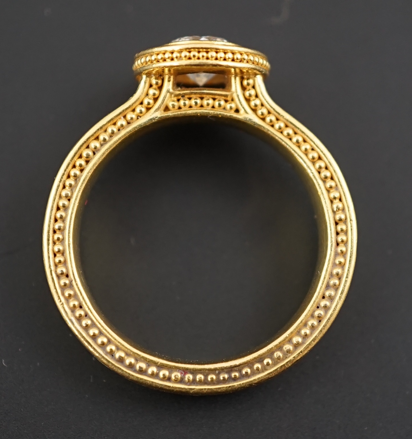 A 22k gold and collet set solitaire diamond dress ring